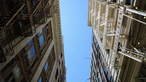 Tilt Down: Buildings with illuminated light bulbs in city - San Francisco, Calif Stock Footage 149715357