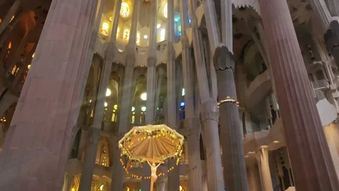 Tilt down from ceiling to Crucifix inside Sagrada Familia Stock Footage 282843337