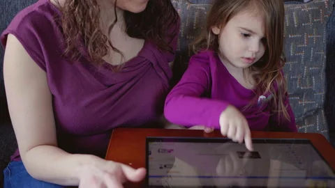 Tilt Down from Child to Touchscreen Computer Homework Vidéo 150277452