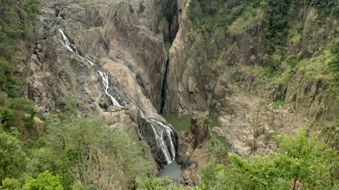Tilt down clip of barron falls during dry season flows Stock Footage 220325445