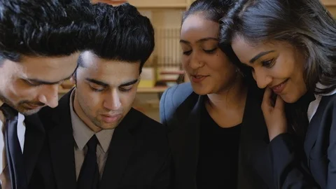 Tilt down from closeup of faces of business people looking concerned and staring Stock Footage 104530990