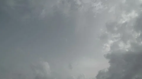 Tilt down from Clouds to Ocean Stock Footage 46620544