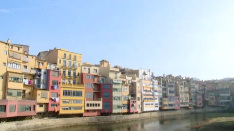 Tilt down on colorful facade river front Stock Footage 42159128