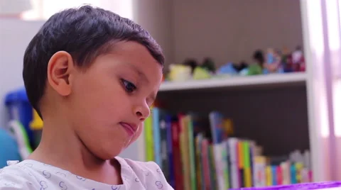 TILT DOWN. Convalecient child playing with a nurse. Stock Footage 45820857