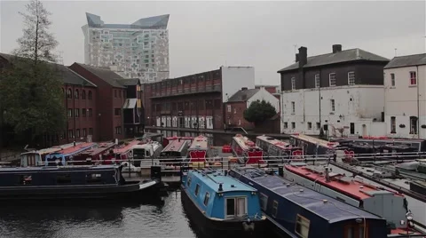 Tilt Down From The Cube Building to Narrow Boats Docked in Canal Harbor Video stock 44524837