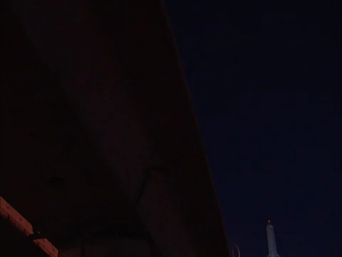 Tilt down from dark sky to reveal Zakim Bunker Hill Bridge under full moon Stock Footage 86750301
