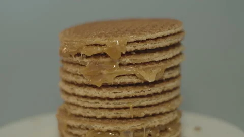 Tilt down of delicious stack of stroopwafels, a typical dutch cookie Stock Footage 142784211