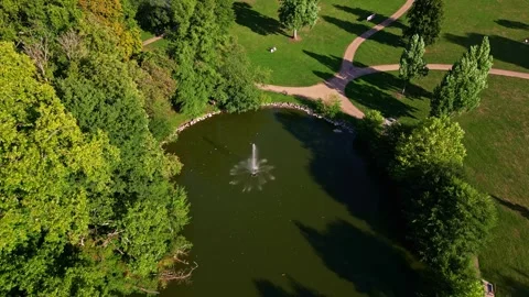 Tilt down drone movement over The Ondine Park aka Le Parc des Ondines' pond Stockbeeldmateriaal 315282464