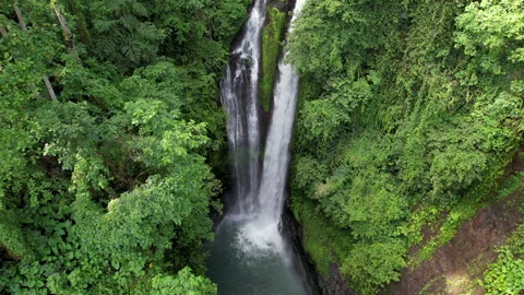 Tilt down drone shot of Aling Aling waterfall. Bali, Indonesia. Stock Footage 285992707