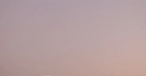 Tilt down from dusk sky to Downtown Los Angeles skyline at dusk 4K Stock Footage 67490649