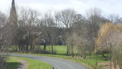 Tilt down to an empty bend in a road Stock Footage 94624750