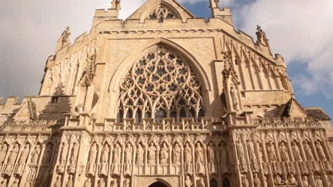 Tilt down of the facade of Exeter Cathedral Stock Footage 142322601