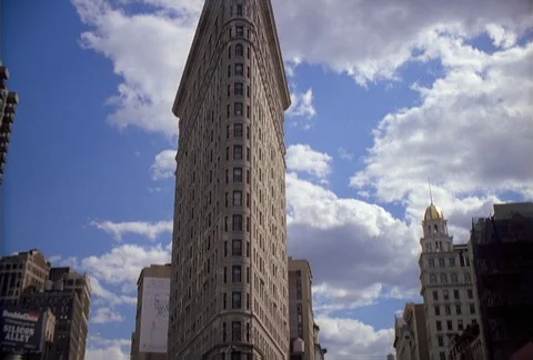 Tilt-down from Flatiron Building to Fifth Avenue in New York City Stock Footage 86914063