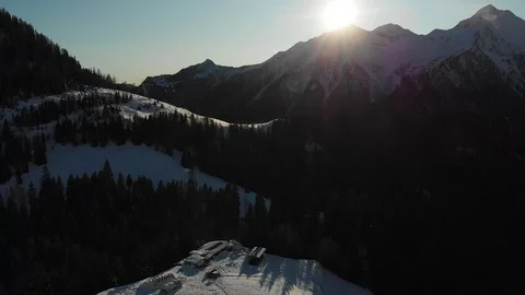 Tilt down flight over the Italian Alps near Foppolo Stock Footage 121891792