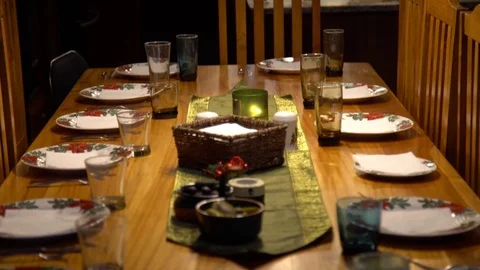 Tilt Down on Formal Dining Table Set with Dishes, Silverware, and Glasses Stock Footage 70876347