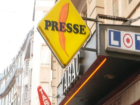 Tilt-down to French press reporting about Bataclan Terrorist attack in Paris Stock Footage 80624527