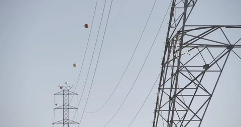Tilt down High Tension Power Lines in Desert Stock Footage 89942500