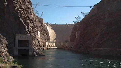 Tilt down of Hoover Dam from below - Tilting down from the Bridge Stock Footage 137612065