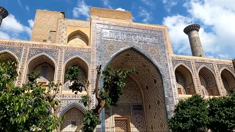 Tilt down of the inner courtyard and portal at Sher-Dor Madrasa Stock Footage 336913610