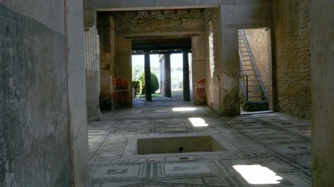 Tilt down inside remaining of a house in ruins of Pompeii Italy with mosaic Video stock 113258083