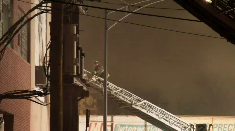 Tilt down ladder firemen Stock Footage 645371