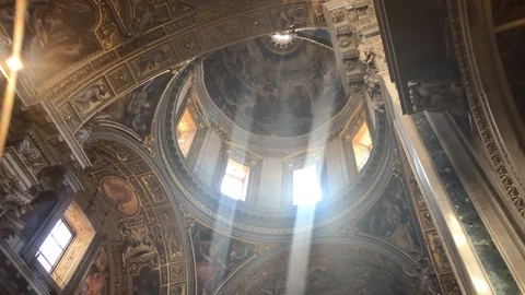 TILT DOWN FROM LIGHT RAYS IN A CHURCH DOME IN ROME Stock Footage 97520514