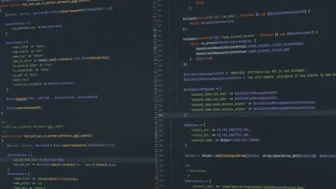 Tilt down of lines of computer code on screen Stock Footage 231098917