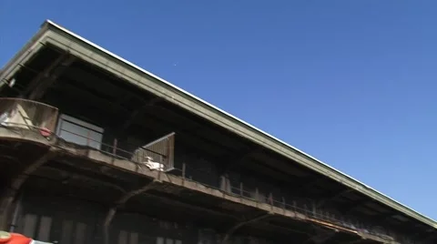 Tilt down loading platforms and storage compartments Katoenveem warehouse Stock Footage 49096549