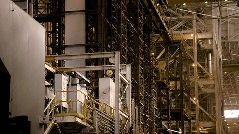 Tilt Down of Modern Steel Mill I-Beams and flag Stock Footage 89944607