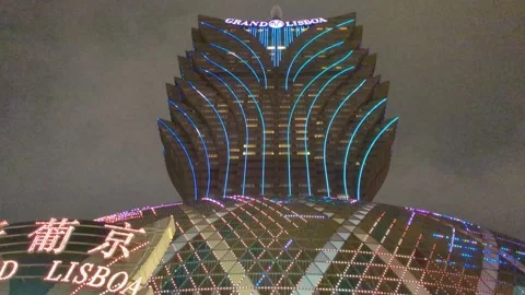 Tilt down night view of Grand Lisboa in Macau, 4k Stock Footage 271236798