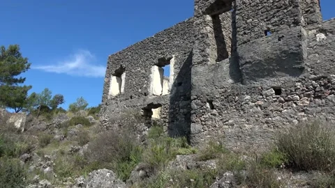 Tilt down old brick wall of Kayakoy ruins Video stock 150988604