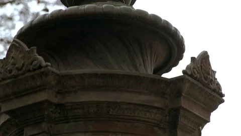 Tilt down of old drinking fountain in Rossio square in Lisbon, Portugal Stock Footage 115699462