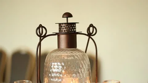 Tilt Down Old Fashioned Lantern and Candles on Table Stock Footage 11874673