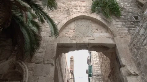 Tilt down to the old narrow streets of Hvar Stock Footage 63034894