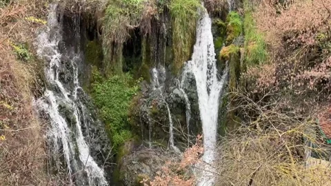Tilt down of one of the main waterfalls in Tobera Stock Footage 327493986