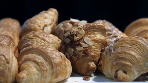 Tilt down over 2 plates of croissants 動画素材 126716239