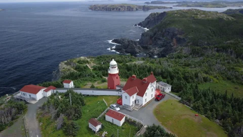 A tilt down pass over of the Long Point Lighthouse Stock Footage 228685791