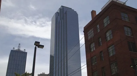Tilt down to passing mass transit train in city Stock Footage 63442918