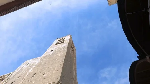 Tilt down to people in front of shops facing Umayyad Mosque, Damascus, Syria Stock Footage 119505679
