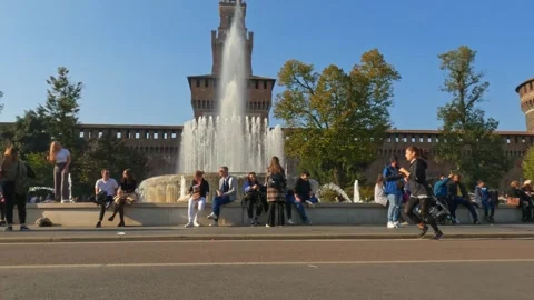Tilt down of people at sforza castle fountain square, milan Stock Footage 281179375