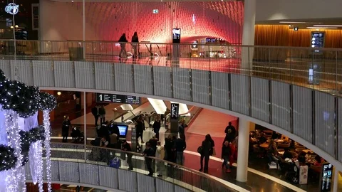 Tilt down of people walking shopping inside mall of Scandinavia center Christmas Stock Footage 71147341
