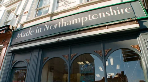 Tilt Down to Quaint Shop Front Stock Footage 61486889