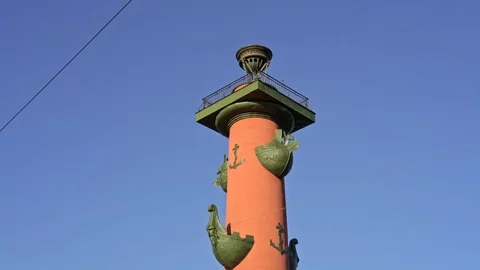 Tilt down of red-painted rostral columns in Saint Petersburg 스톡 동영상 110852219