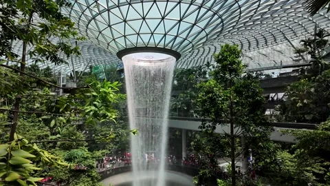 Tilt-Down Reveal of Rain Vortex at Jewel Singapore Stock Footage 316133939
