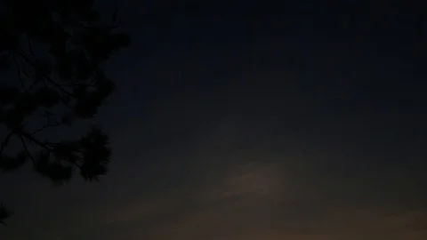 Tilt down reveal of sunset over northern canadian lake Stock Footage 90260243