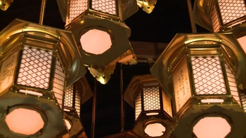Tilt down revealing toro lanterns in Japanese temple Video stock 86758937