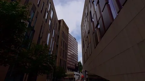 Tilt down revealing two modern buildings Video stock 200262238