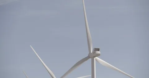 Tilt Down Row of Wind Mills In Motion Stock Footage 89942432