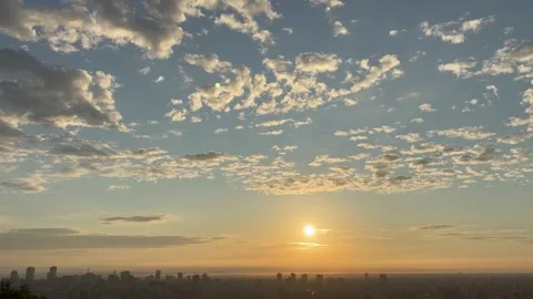 Tilt down shot of the cityscape from the clear sky after sunrise Stock Footage 314912762
