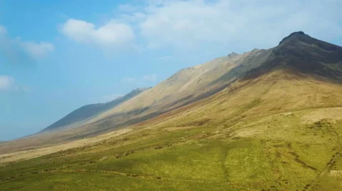 Tilt down shot of green mountain Stock Footage 63629309
